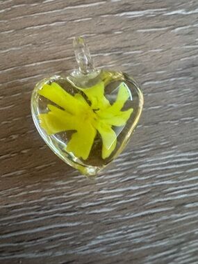 Glass pendant with yellow flower